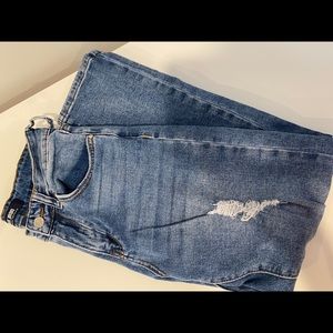 Distressed blue jeans